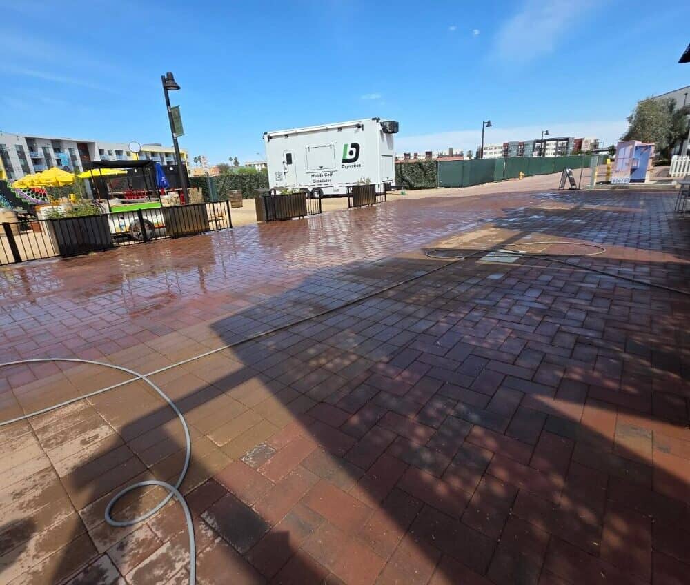 Clean Surface technicians cleaning a large commercial concrete area
